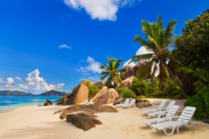 Chairs on tropical beach at Seychelles - vacation background