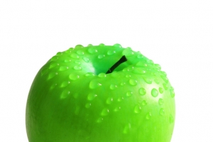Apple with water drops isolated on white